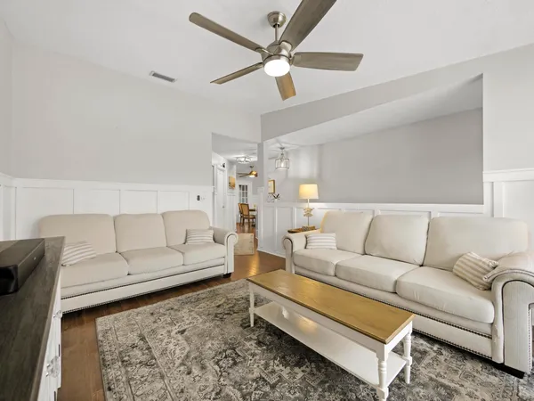 a living room with furniture and a rug