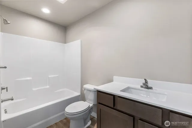 a kitchen with stainless steel appliances a sink and a refrigerator
