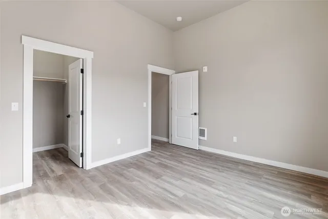 a view of a car is parked in front of a building