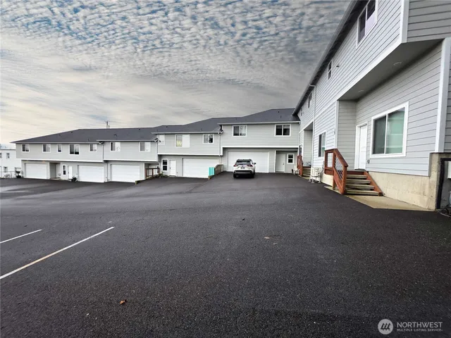 a house view with a two chair and a ceiling fan
