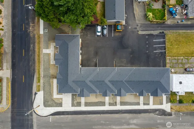 an aerial view of residential houses with outdoor space