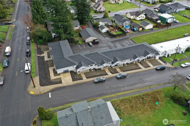an aerial view of a house with a yard