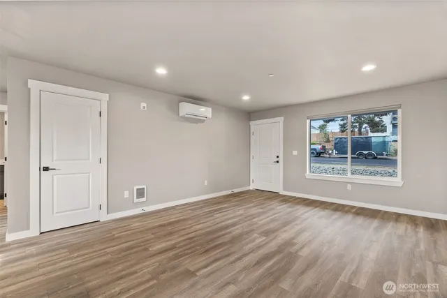 a kitchen with kitchen island a sink stainless steel appliances and refrigerator