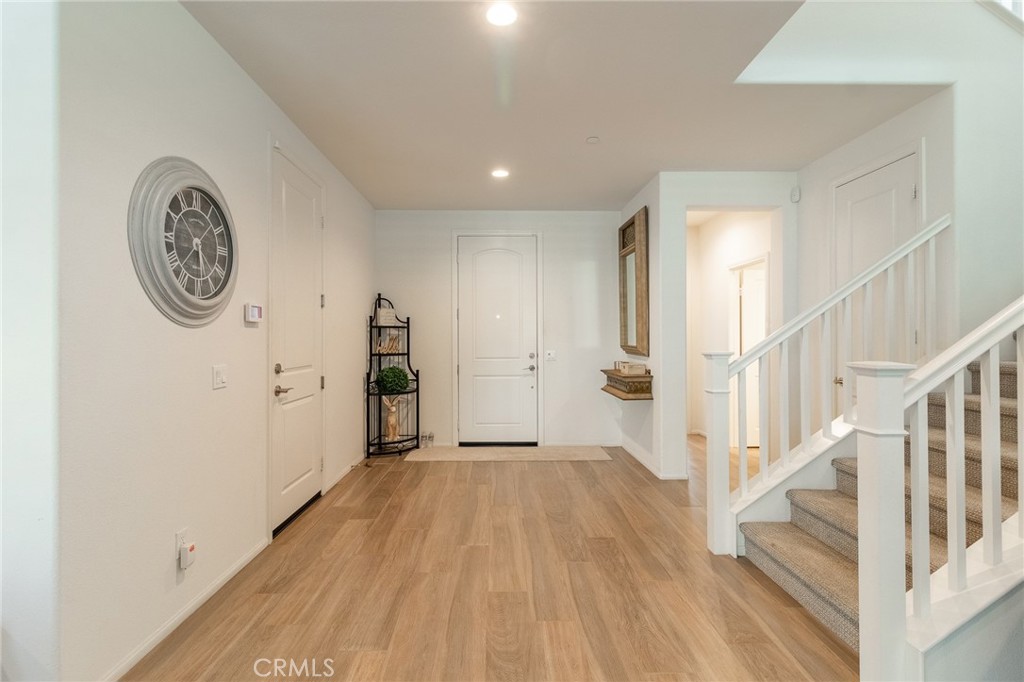 1827 Montecito Lane Redlands, CA 92374 - Photo 19 of 60 a view of a hallway with wooden floor