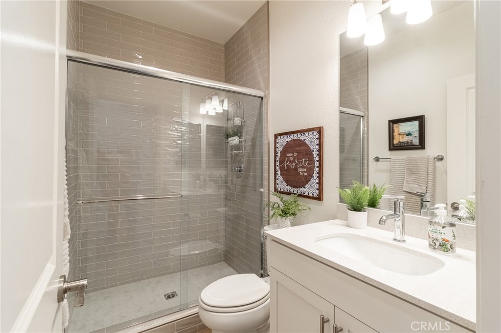 1827 Montecito Lane Redlands, CA 92374 - Photo 20 of 60 a bathroom with a sink a toilet and shower