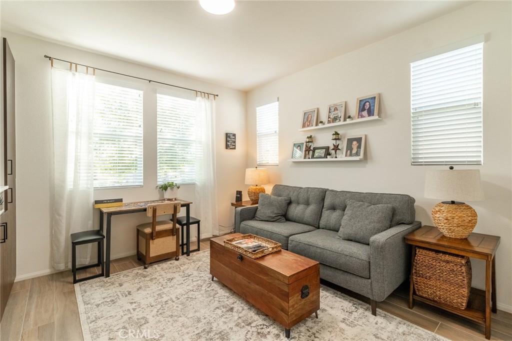 1827 Montecito Lane Redlands, CA 92374 - Photo 21 of 60 a living room with furniture rug and window