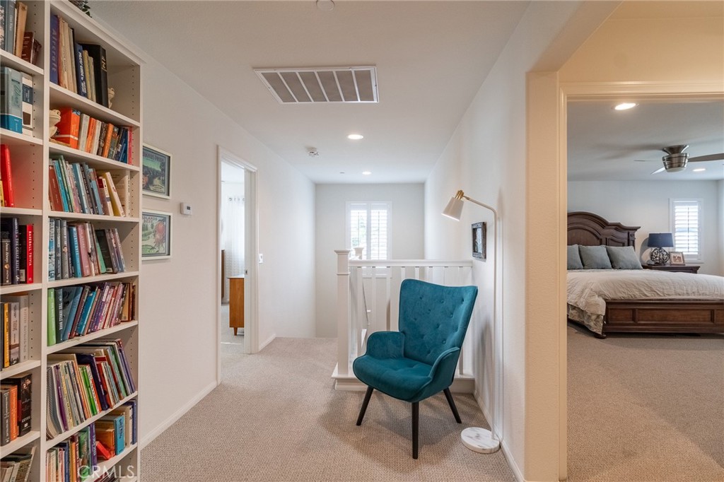 1827 Montecito Lane Redlands, CA 92374 - Photo 25 of 60 a bedroom with furniture and a book shelf