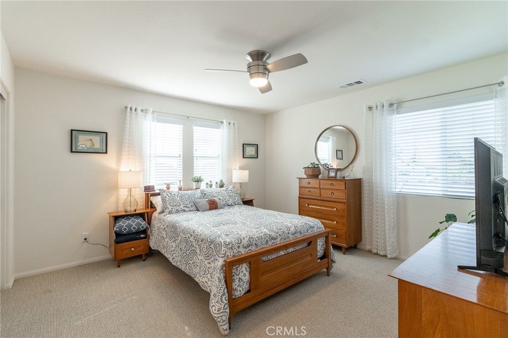 1827 Montecito Lane Redlands, CA 92374 - Photo 26 of 60 a bedroom with a bed and a flat screen tv