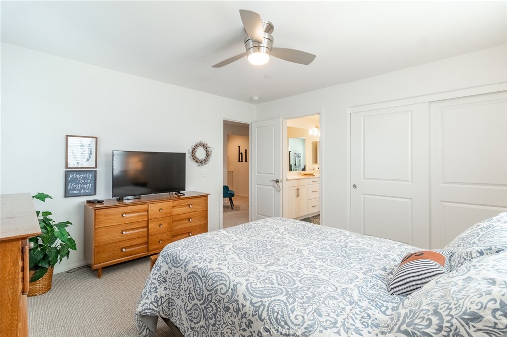 1827 Montecito Lane Redlands, CA 92374 - Photo 27 of 60 a bedroom with a bed and a flat screen tv
