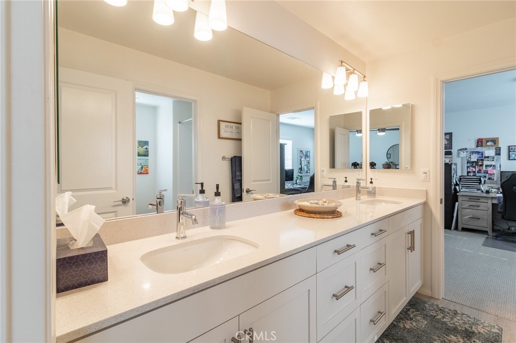 1827 Montecito Lane Redlands, CA 92374 - Photo 28 of 60 a bathroom with double vanity sinks and a mirror