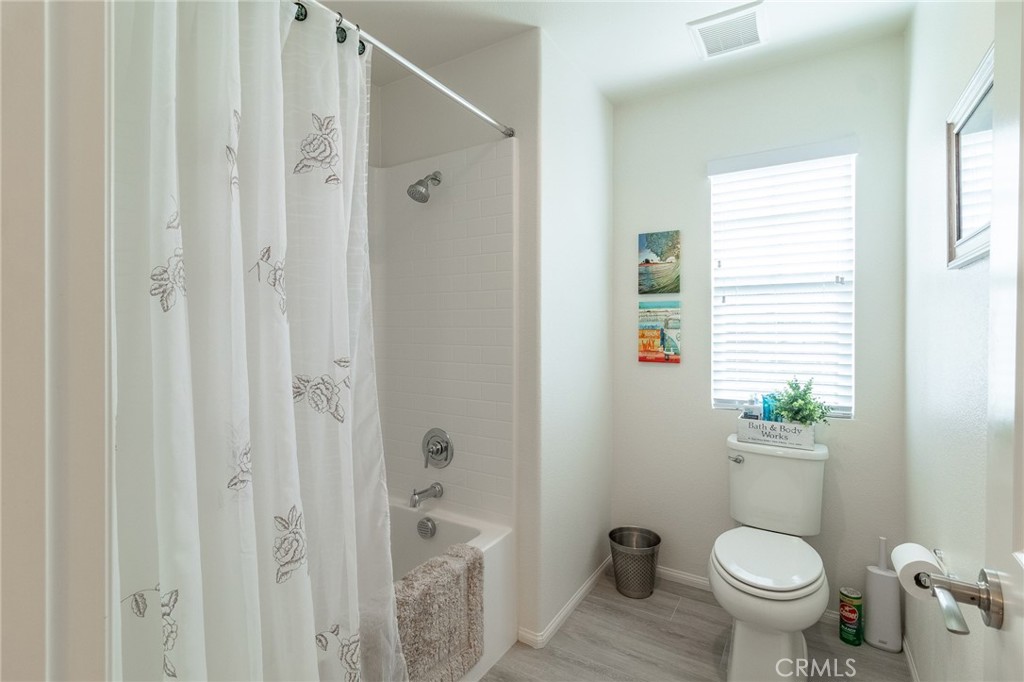 1827 Montecito Lane Redlands, CA 92374 - Photo 29 of 60 a bathroom with a toilet and a shower
