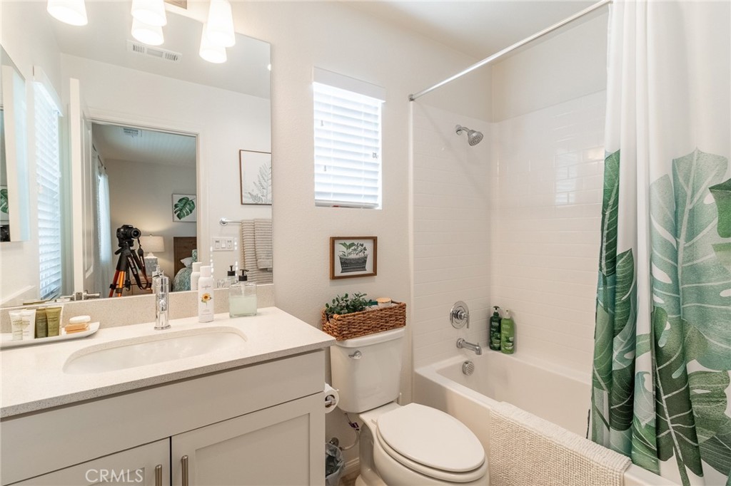 1827 Montecito Lane Redlands, CA 92374 - Photo 34 of 60 a bathroom with a sink a toilet a tub and shower