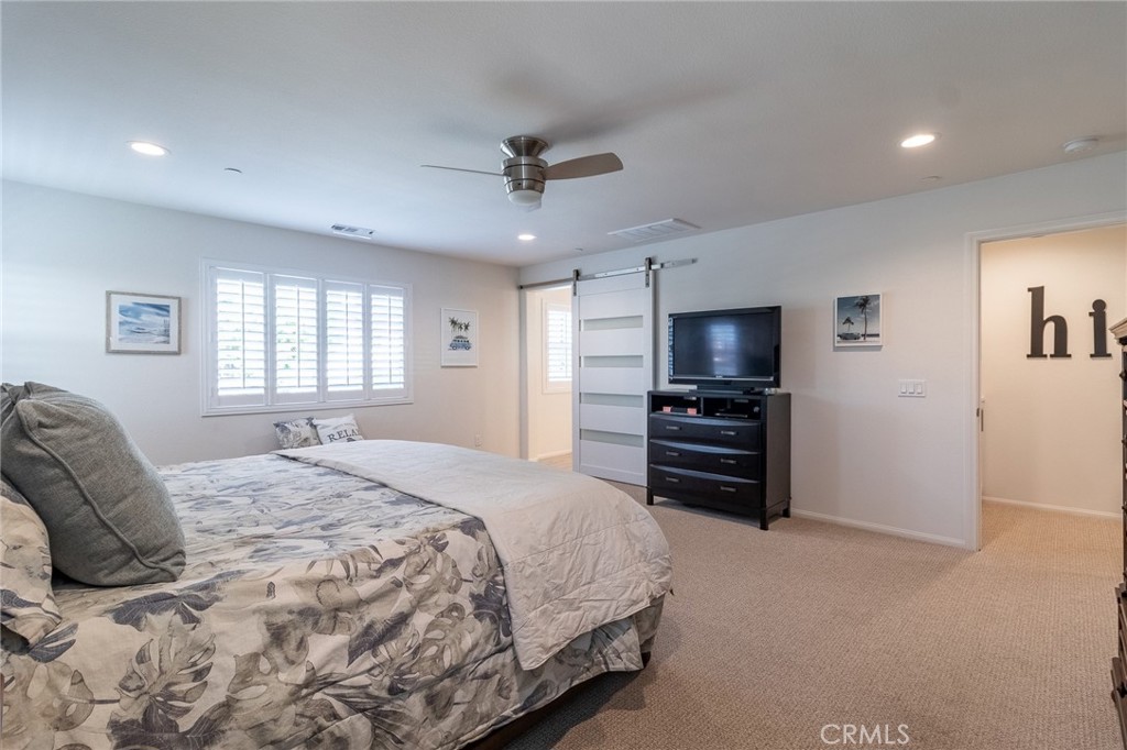 1827 Montecito Lane Redlands, CA 92374 - Photo 38 of 60 a bedroom with a bed and a television