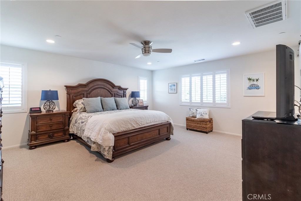 1827 Montecito Lane Redlands, CA 92374 - Photo 39 of 60 a bedroom with a bed and dresser with window