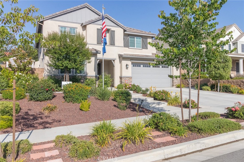 1827 Montecito Lane Redlands, CA 92374 - Photo 4 of 60 a front view of a house with a yard and potted plants