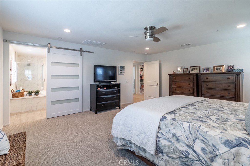 1827 Montecito Lane Redlands, CA 92374 - Photo 41 of 60 a bedroom with a bed and cabinets