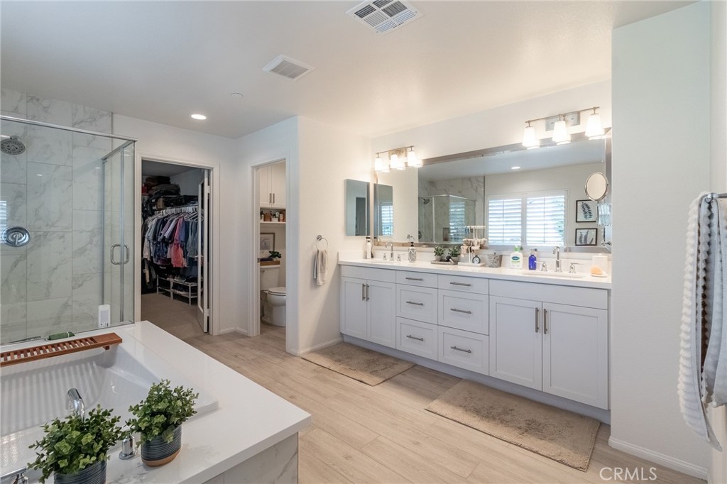 1827 Montecito Lane Redlands, CA 92374 - Photo 42 of 60 a spacious bathroom with a double vanity sink and a shower
