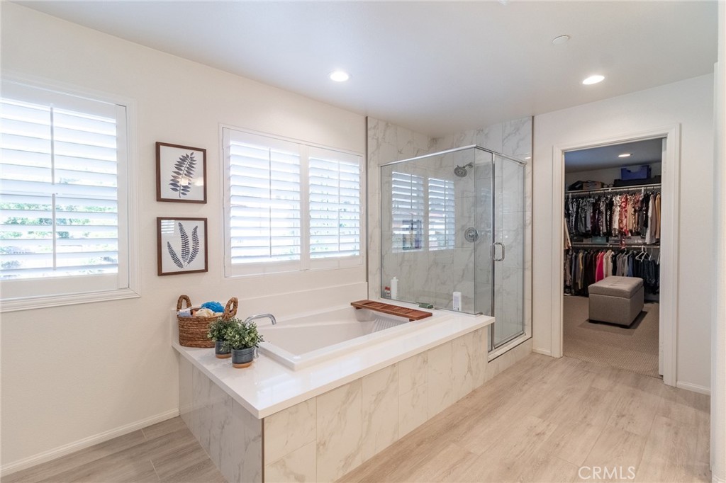 1827 Montecito Lane Redlands, CA 92374 - Photo 43 of 60 a spacious bedroom with a bed and a couch