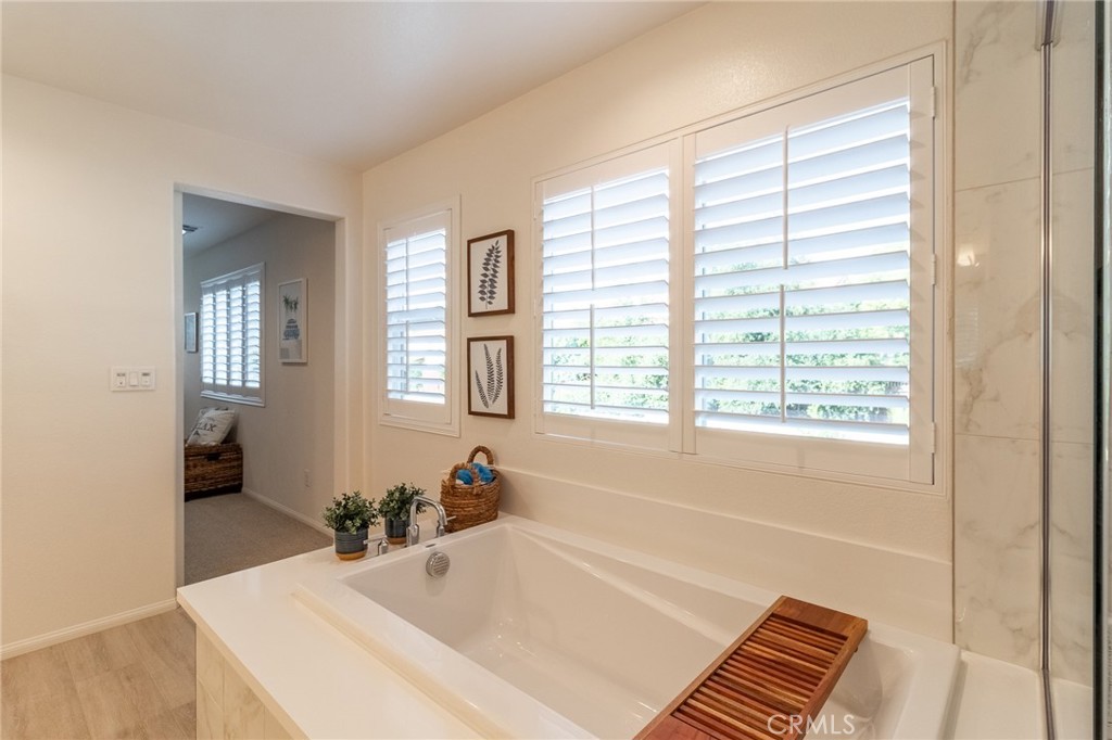 1827 Montecito Lane Redlands, CA 92374 - Photo 45 of 60 a bath tub sitting in a bathroom next to a window