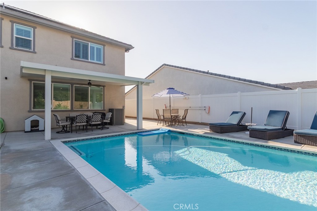 1827 Montecito Lane Redlands, CA 92374 - Photo 49 of 60 a view of a house with swimming pool and sitting area