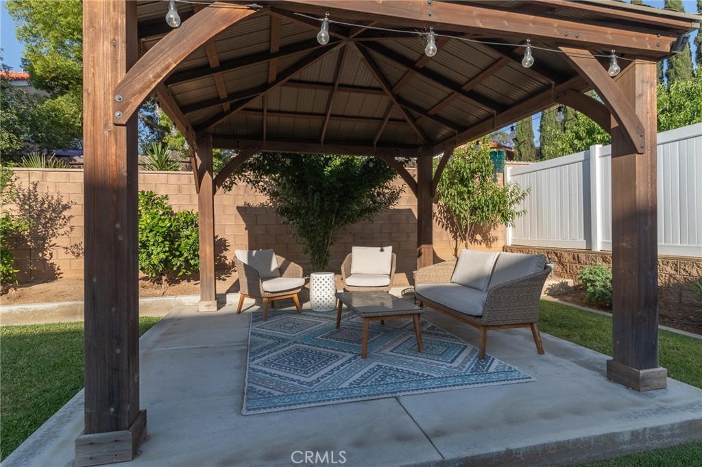 1827 Montecito Lane Redlands, CA 92374 - Photo 50 of 60 a view of table and chairs under an umbrella