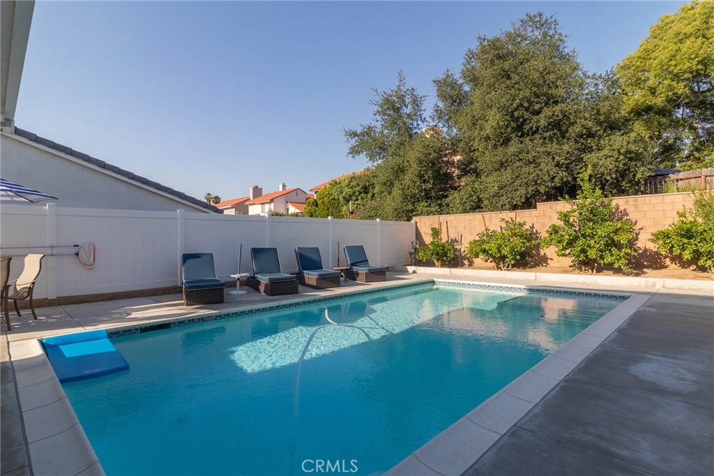1827 Montecito Lane Redlands, CA 92374 - Photo 51 of 60 a view of a swimming pool with a yard