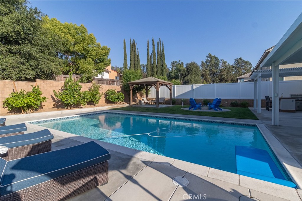 1827 Montecito Lane Redlands, CA 92374 - Photo 53 of 60 a balcony with wooden floor table and chairs