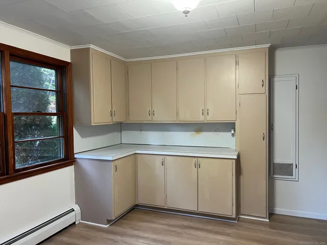 a view of cabinets and wooden floor
