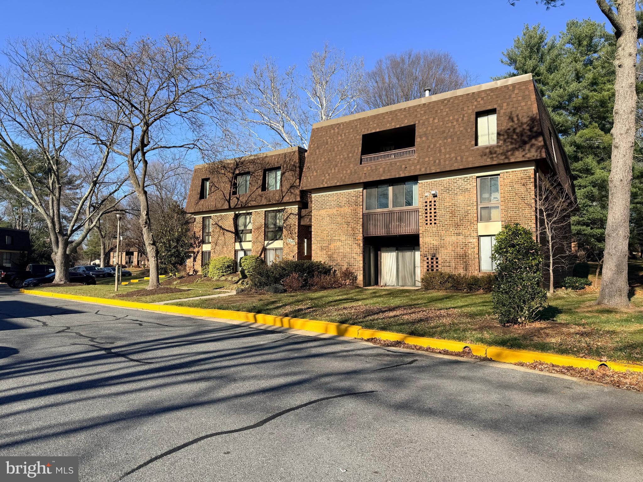 5247 West Running Brook Road, Unit 102 Columbia, MD 21044 - Photo 2 of 28 a view of a house with pool and sitting area