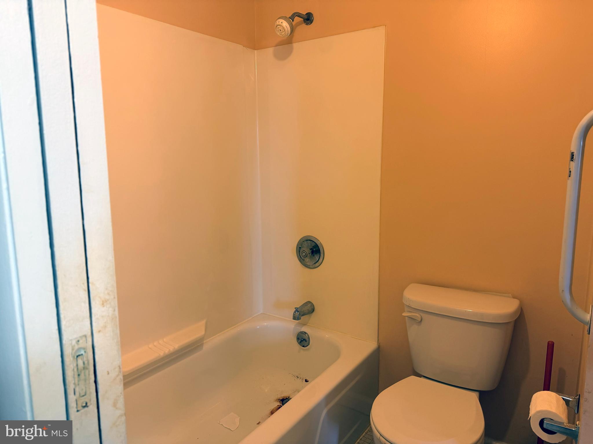 5247 West Running Brook Road, Unit 102 Columbia, MD 21044 - Photo 21 of 28 a white toilet sitting next to a bath tub