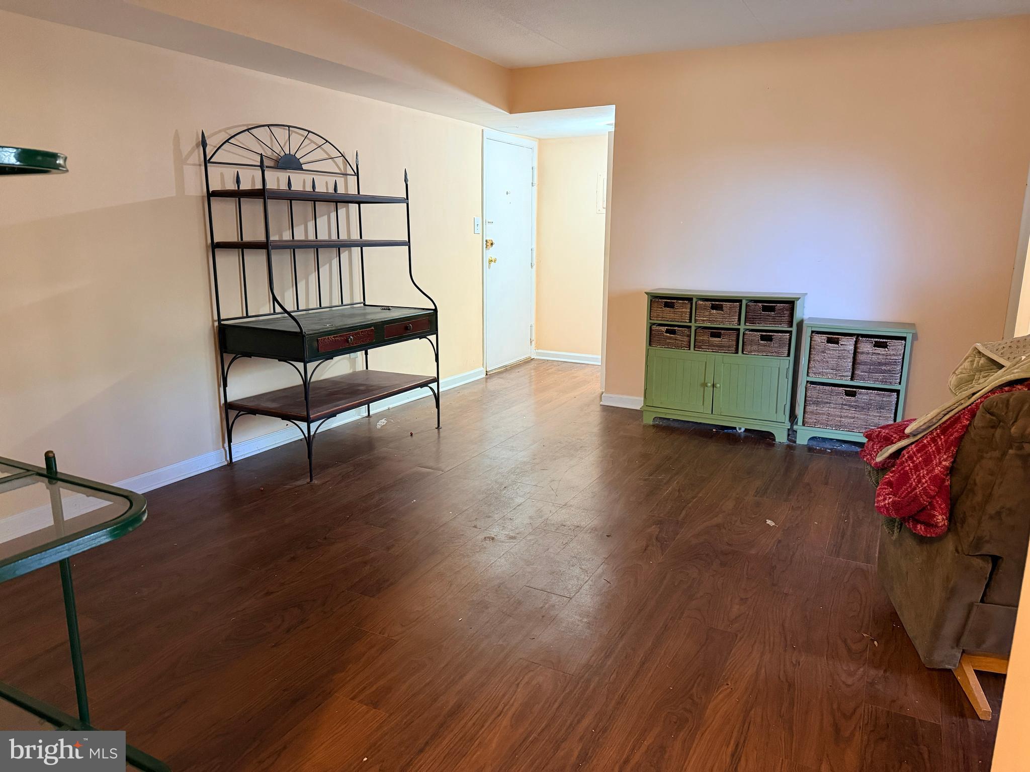 5247 West Running Brook Road, Unit 102 Columbia, MD 21044 - Photo 6 of 28 a view of livingroom with furniture and wooden floor