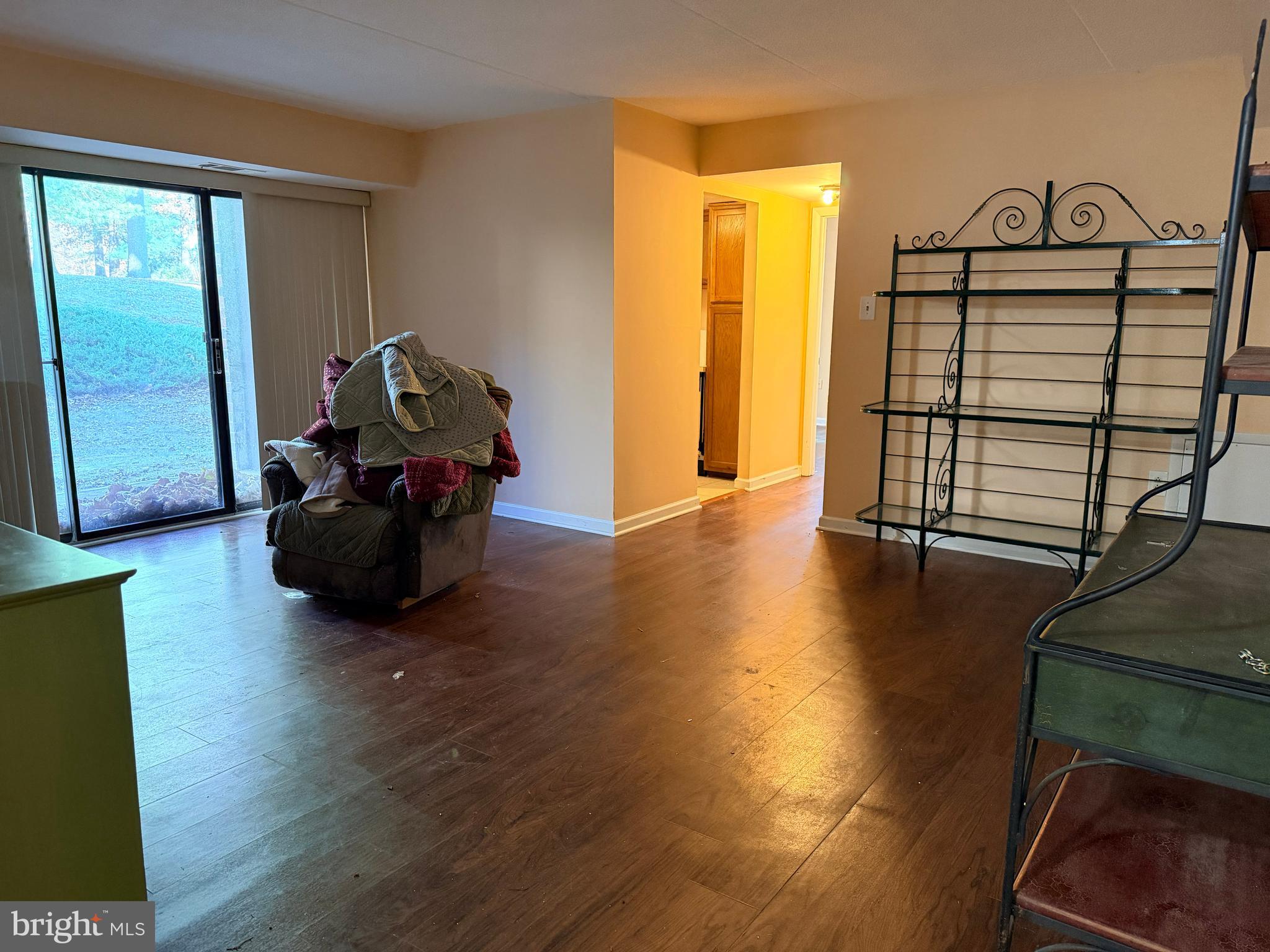5247 West Running Brook Road, Unit 102 Columbia, MD 21044 - Photo 8 of 28 a living room with furniture and a window