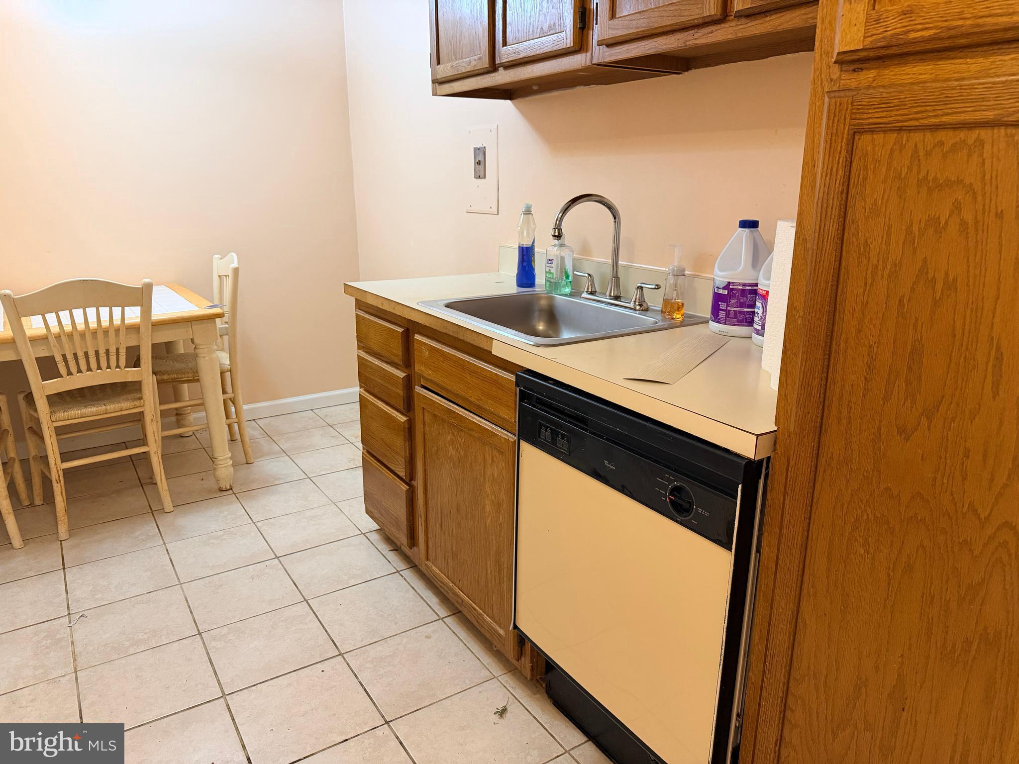5247 West Running Brook Road, Unit 102 Columbia, MD 21044 - Photo 10 of 28 a room with washing machine and cabinets