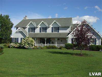 181 Nolf Road Nazareth, PA 18064 - Photo 1 of 19 a front view of a house with a garden