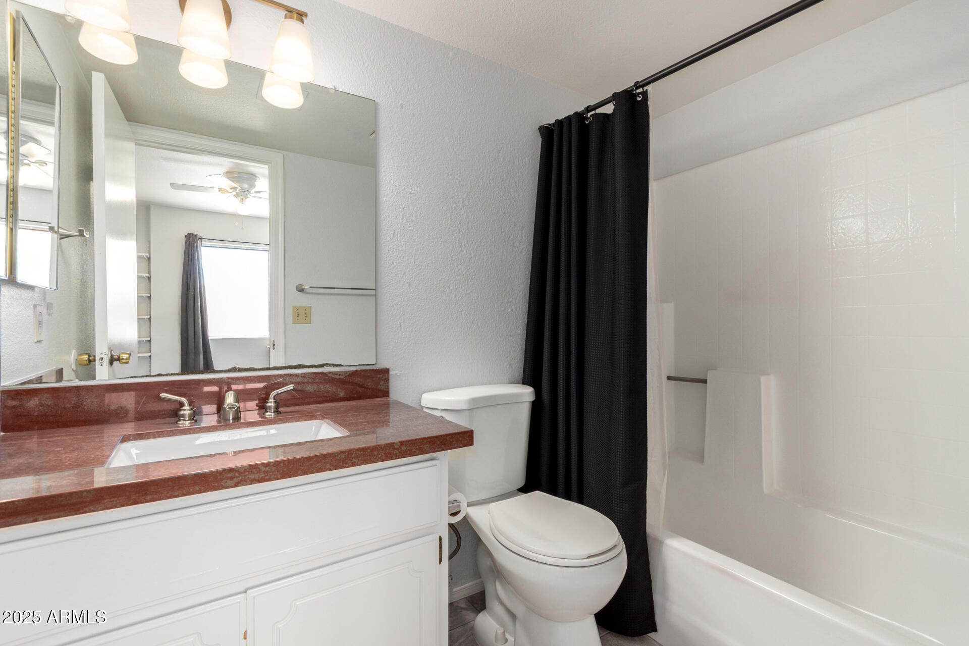 622 West 14th Street Tempe, AZ 85281 - Photo 12 of 18 a bathroom with a granite countertop sink toilet and shower