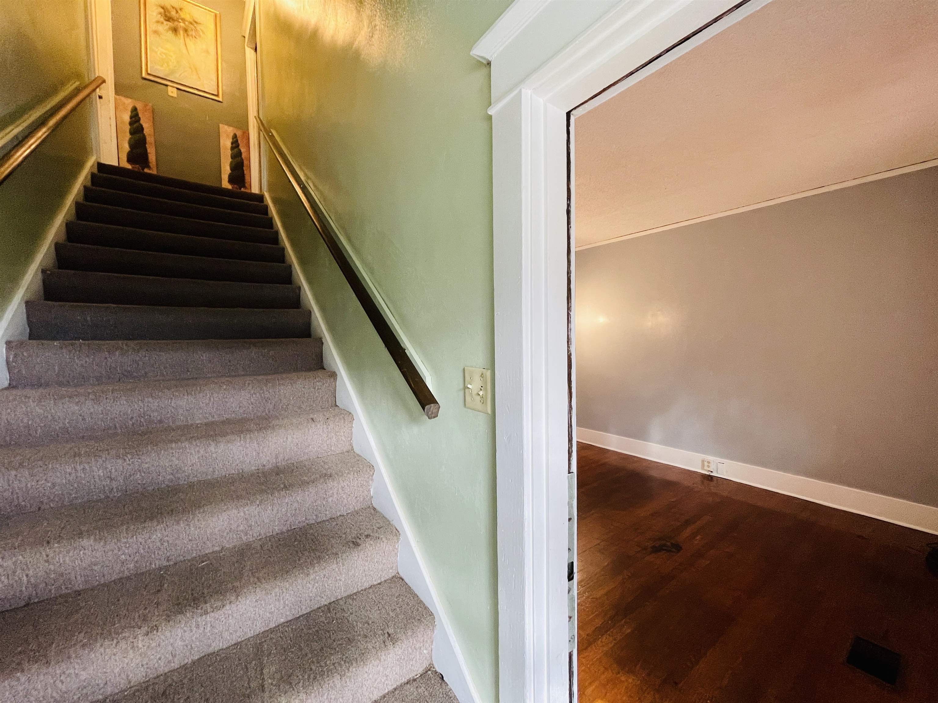 1009 Rozelle Street Memphis, TN 38114 - Photo 26 of 40 Stairway featuring hardwood / wood-style flooring