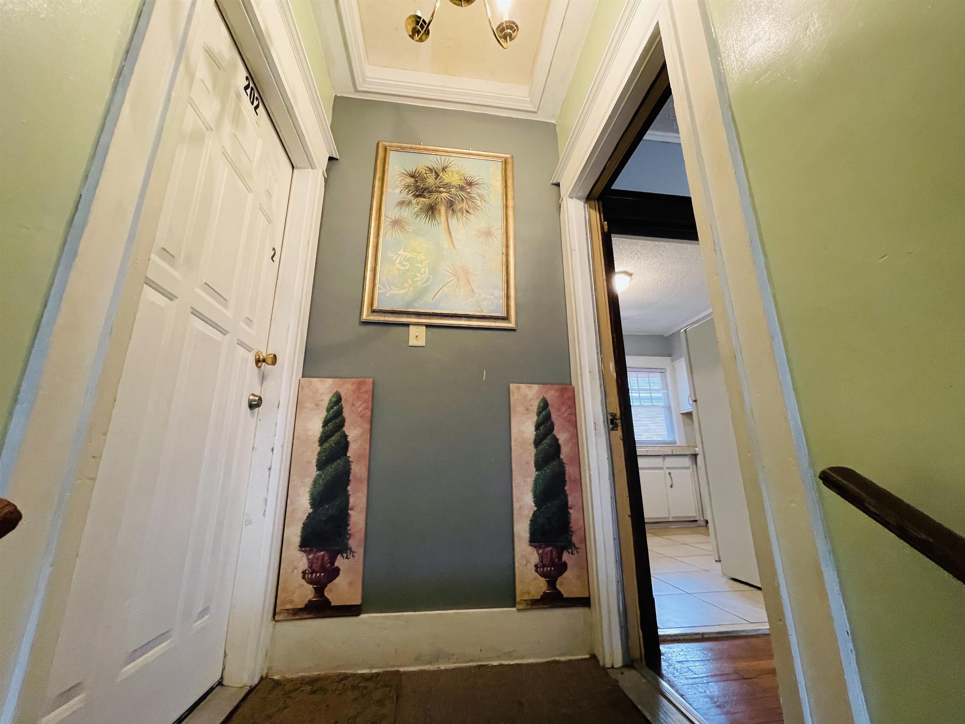 1009 Rozelle Street Memphis, TN 38114 - Photo 28 of 40 Corridor featuring light hardwood / wood-style floors and ornamental molding