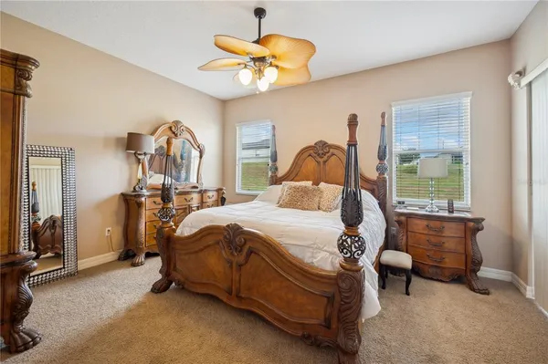 a bed sitting in a room next to a window