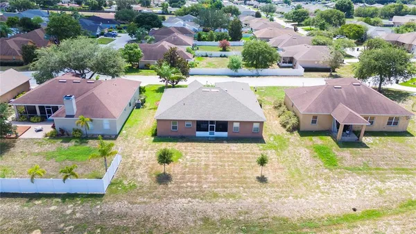 an aerial view of a house with a garden