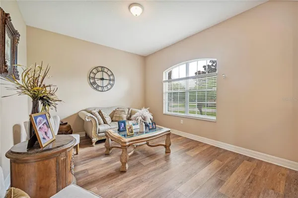 a living room with furniture and a window
