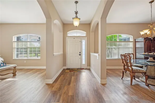 a view of a livingroom with furniture window and wooden floor