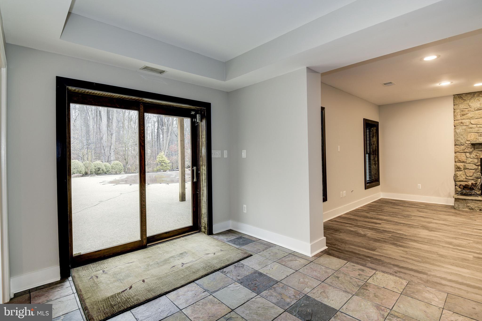 15818 Laughlin Lane Silver Spring, MD 20906 - Photo 46 of 60 Lower level door to patio & pool