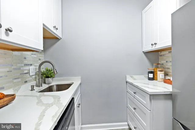 a bedroom with a bed and a lamp