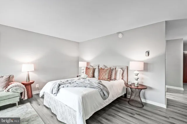 a bathroom with a toilet a sink and a mirror