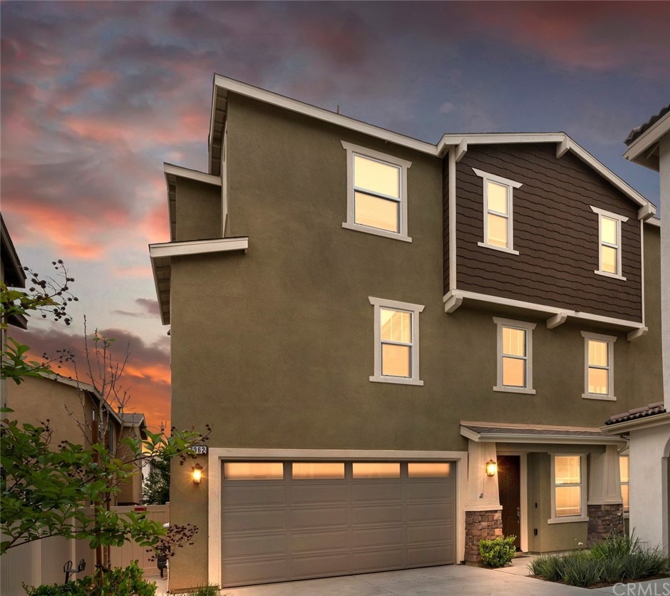 7362 Hawkeye Ridge Road Jurupa Valley, CA 92509 - Photo 1 of 1 a front view of a house with a yard
