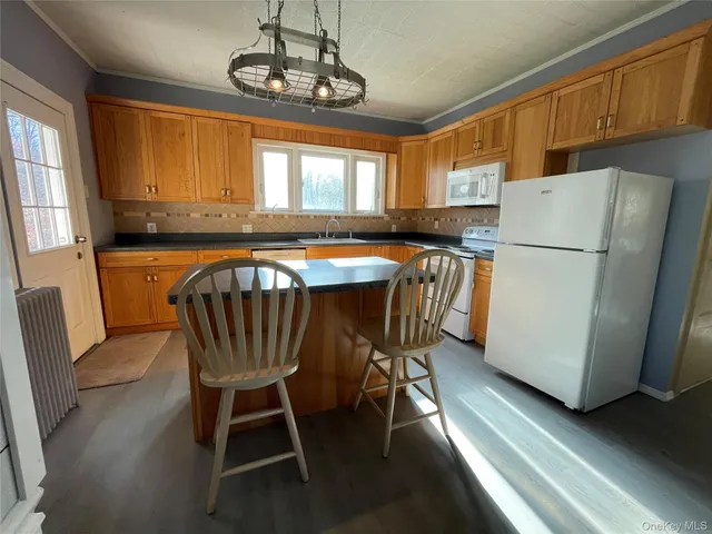 a bathroom with a sink toilet and a mirror