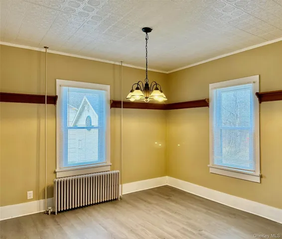 a kitchen with stainless steel appliances granite countertop a stove a chimney a sink and cabinets