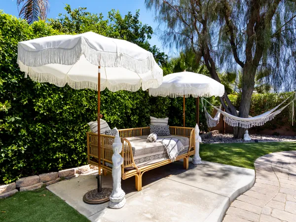 a view of a patio with chairs and a fire pit