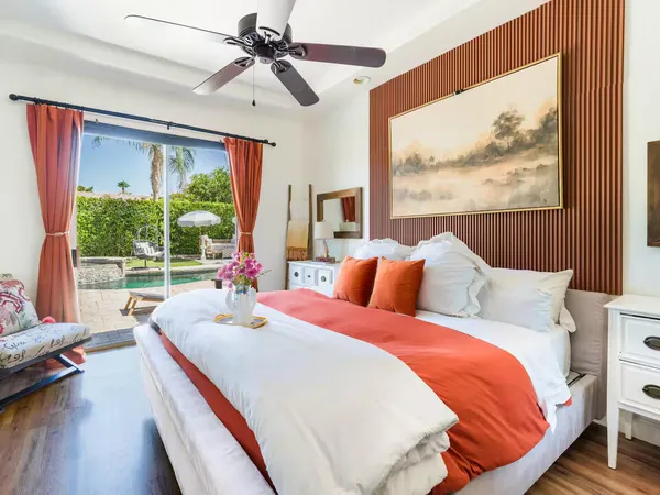 a bed room with a bed and a large window