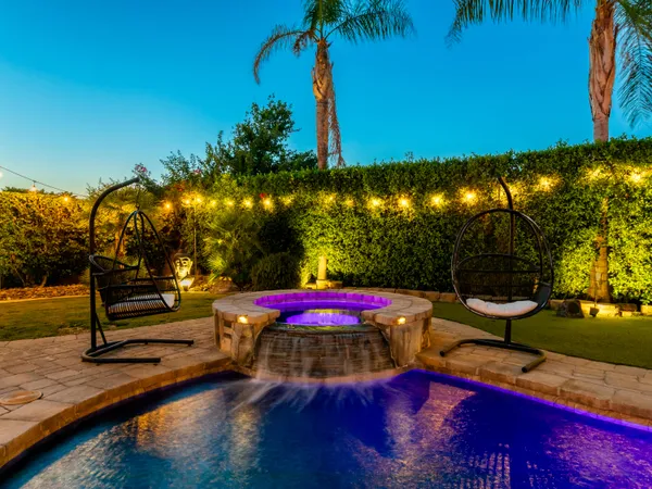 a view of a backyard with a patio